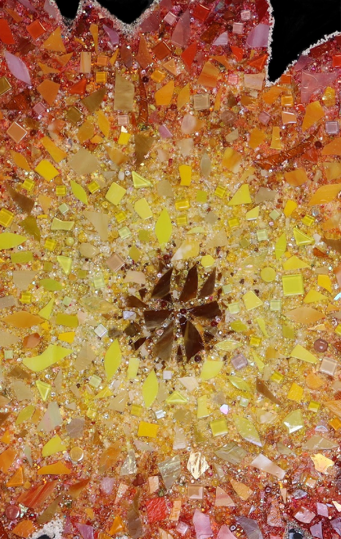 Close-up detail of the custom sun mosaic with warm glass and gemstone-like details